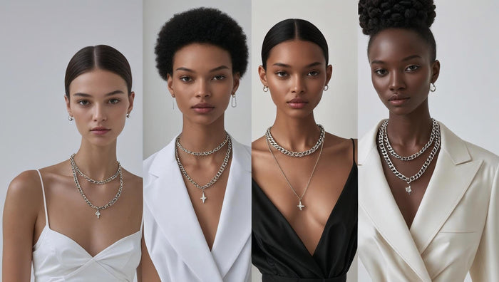 Women wearing bold, layered silver chain necklaces.