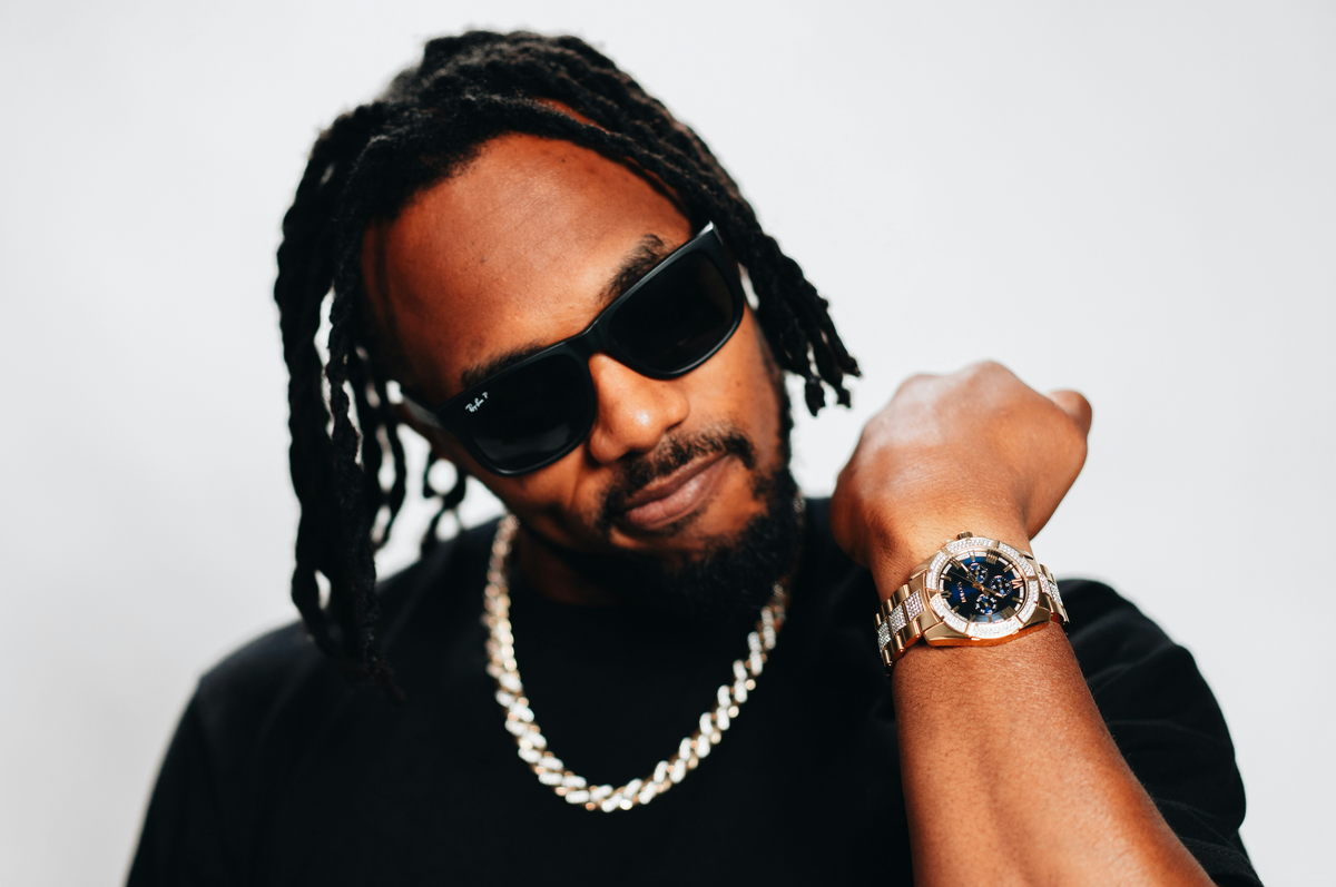 A man showing off a Silver Chain Cuban Necklace