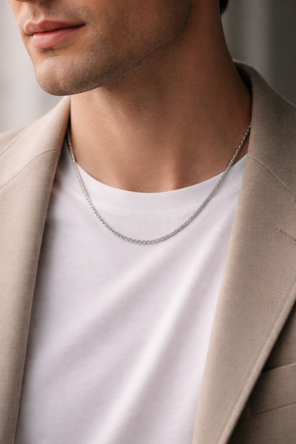 Man wearing Teddy Howler Franco chain necklace with a neutral background