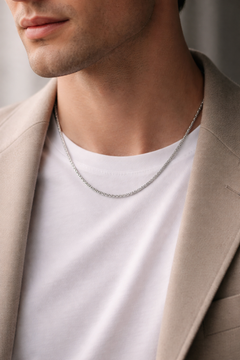 Man wearing Teddy Howler Franco chain necklace with a neutral background